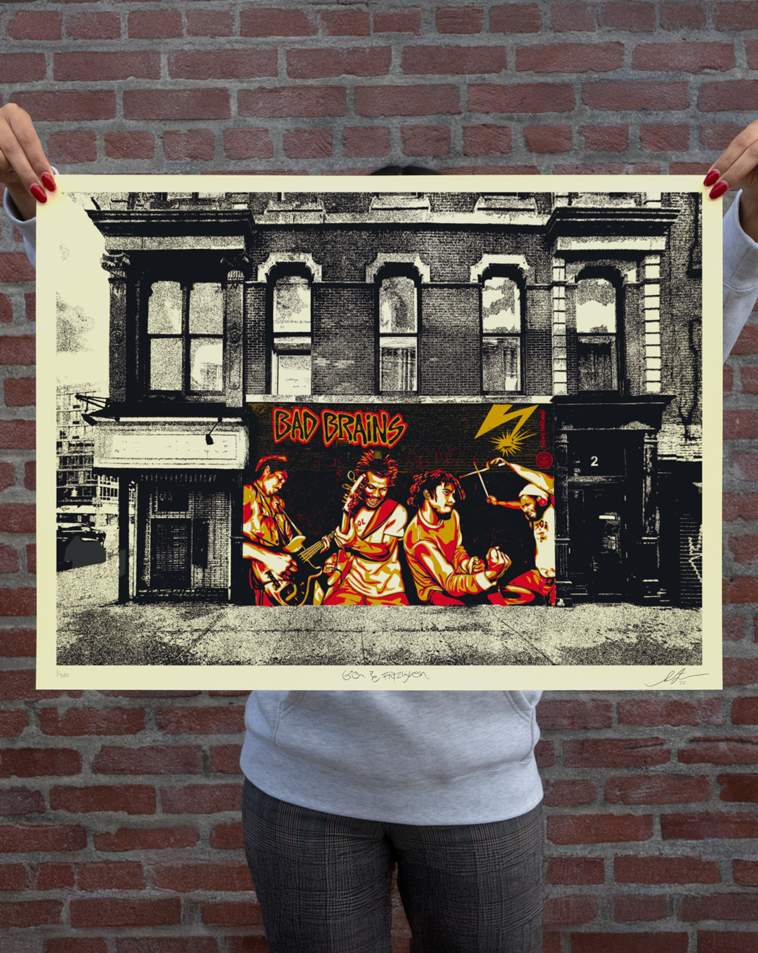 Hands holding a pop art print of the